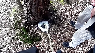 boys pissing together a big foamy puddle readily obtainable a tree